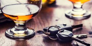Springdale DUI/DWI Lawyer Set of keys next to a cup of alcohol