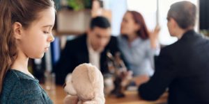 Springdale Family Law Lawyer Image of a sadden kid listening to her parents fight for custody