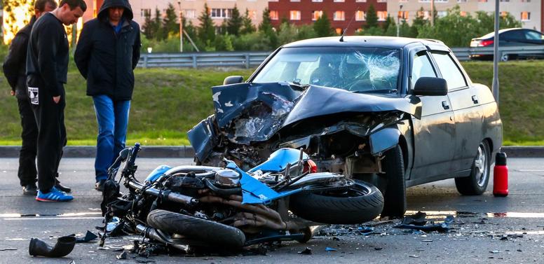 A motorcycle lying on the ground after crashing into another vehicle in Springdale, Arkansas 