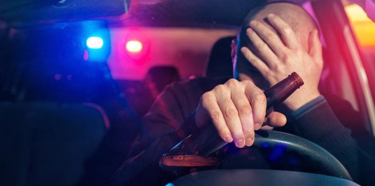 a drunk driver has been stopped by a police officer