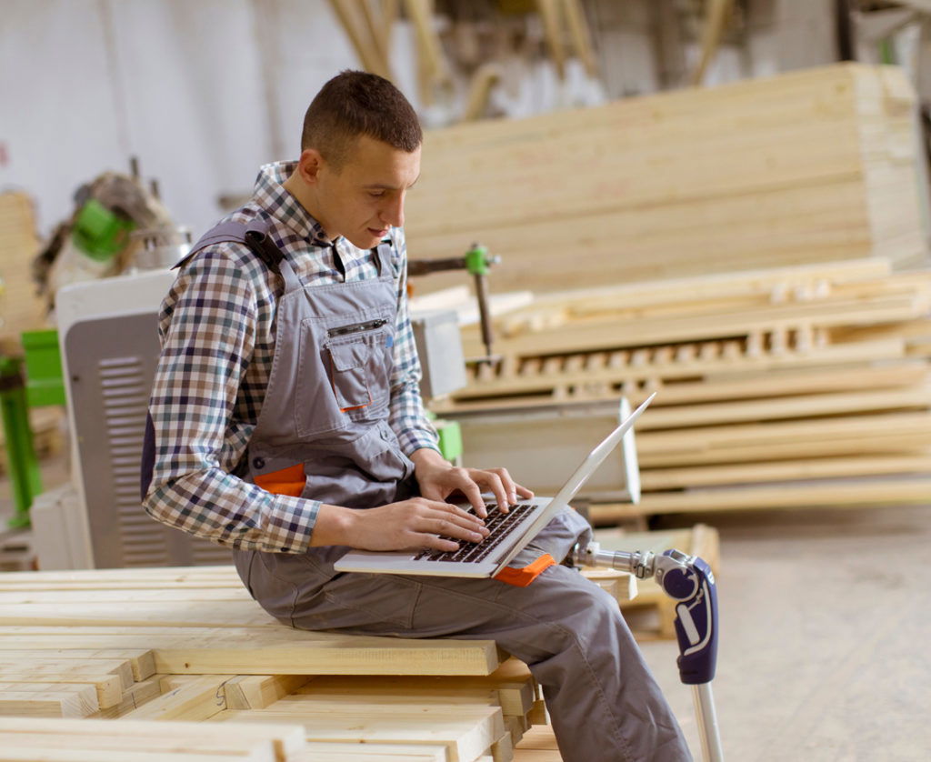 Man with amputated leg working at jobsite